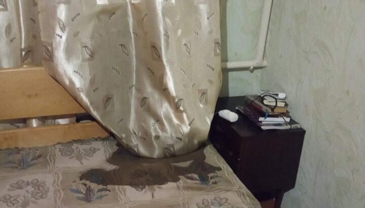 One of the buckets of sewage spilt onto the bed where the priest's grandson was sleeping. Photo: pravoslavna.volyn.ua