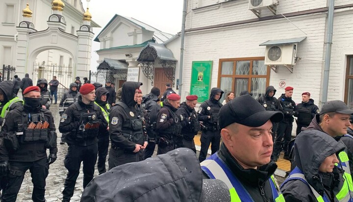Police officers in the Lavra provide a 