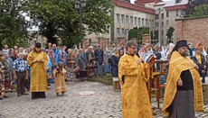 Parishioners of the cathedral in Bila Tserkva pray outside the fence