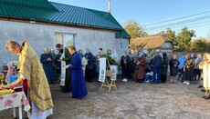 UOC believers of Bortnychi pray outside church fence on their feast day