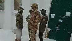 People in camouflage block Trinity Cathedral in Chernihiv