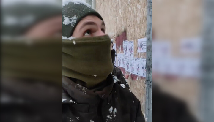Young people in balaclavas on the monastery grounds. Photo: screenshot from video