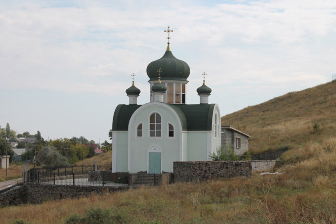 Oameni şi biserici de pe linia frontului: oraşul Mariupol фото 12